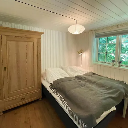 Lovely Black Wooden House Near Hegn Feriehus *