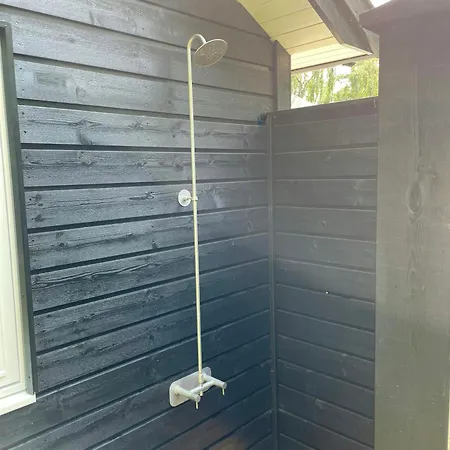 Lovely Black Wooden House Near Hegn Feriehus